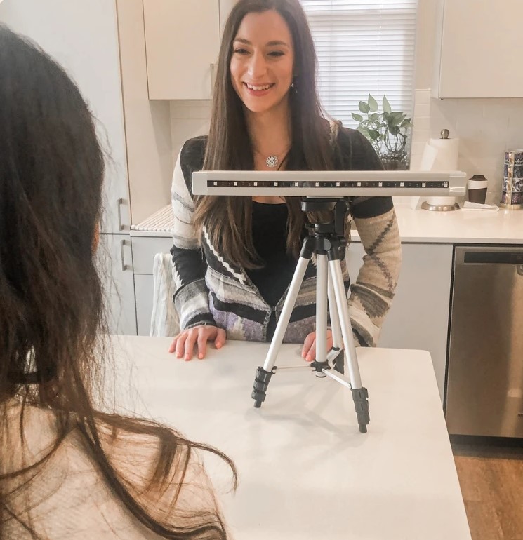Therapist smiling across from a client during an EMDR session