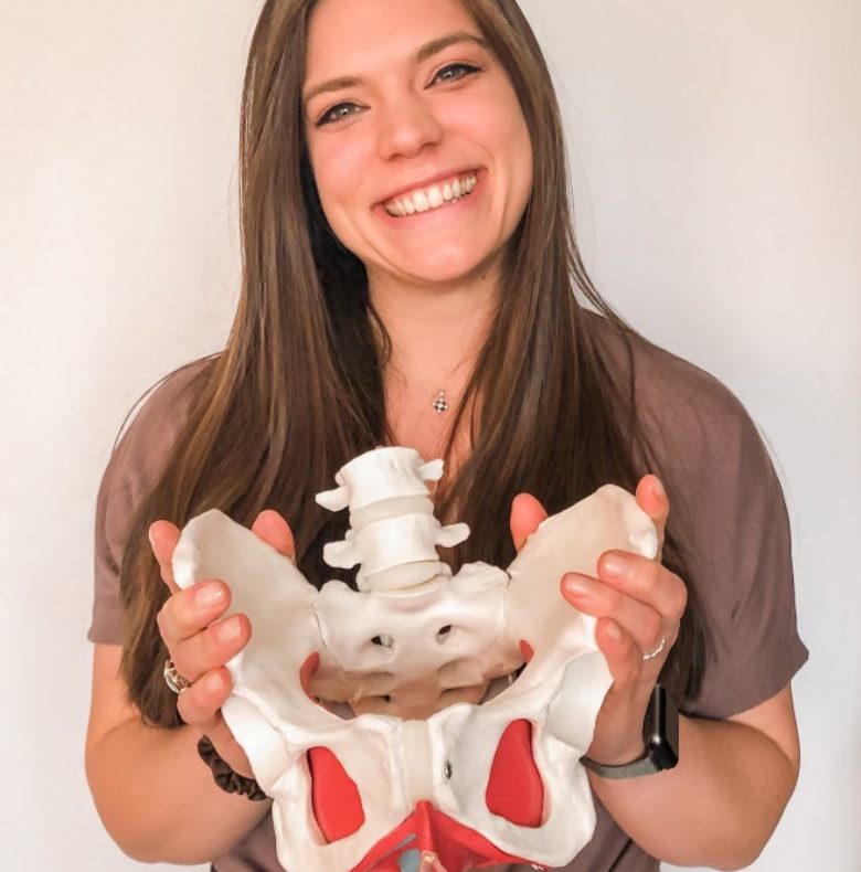 Dr. Kim holding a pelvis model